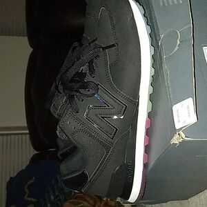 Women's Black New Balance. Worn once with a colorful sole.